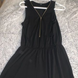 Zip up black romper short.